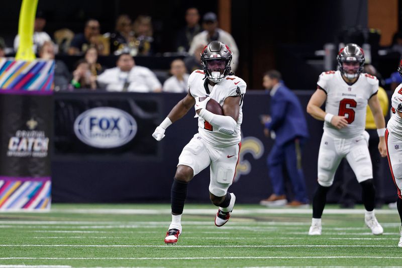 Tampa Bay Buccaneers running back Rachaad White (1) runs the ball during an NFL football game against the New Orleans Saints, Sunday, Oct. 1, 2023, in New Orleans. (AP Photo/Tyler Kaufman)