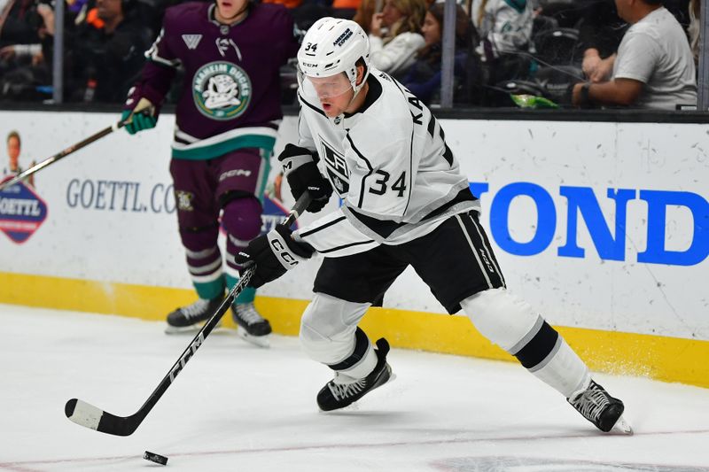 Nov 24, 2023; Anaheim, California, USA; Los Angeles Kings right wing Arthur Kaliyev (34) controls the puck against the Anaheim Ducks during the first period at Honda Center. Mandatory Credit: Gary A. Vasquez-USA TODAY Sports