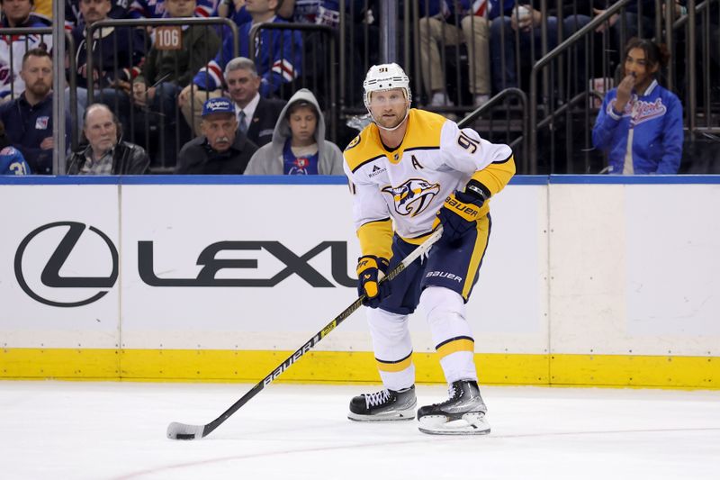 Nov 10, 2025; New York, New York, USA; Nashville Predators center Steven Stamkos (91) skates with the puck against the New York Rangers during the third period at Madison Square Garden. Mandatory Credit: Brad Penner-Imagn Images