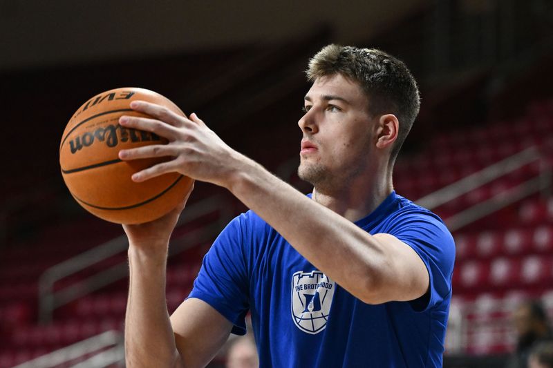 Jan 7, 2023; Chestnut Hill, Massachusetts, USA; Duke Blue Devils center Kyle Filipowski (30) takes a shot during warmups before a game against the Boston College Eagles at the Conte Forum. Mandatory Credit: Brian Fluharty-USA TODAY Sports