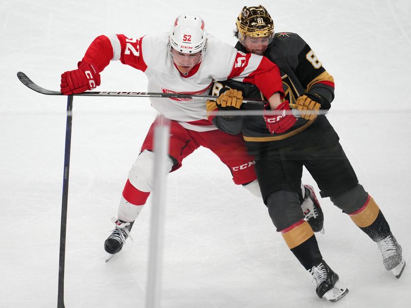 Jan 19, 2023; Las Vegas, Nevada, USA; Detroit Red Wings right wing Jonatan Berggren (52) slows Vegas Golden Knights center Jonathan Marchessault (81) during the third period at T-Mobile Arena. Mandatory Credit: Stephen R. Sylvanie-USA TODAY Sports