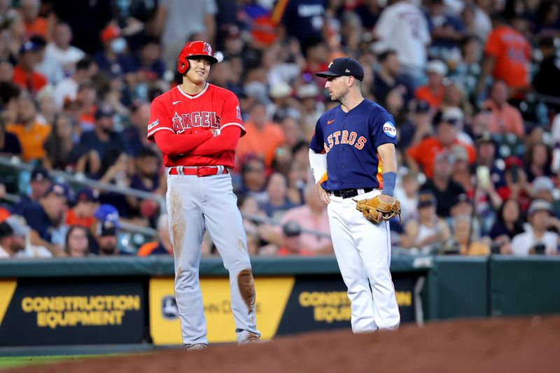 Aug 13, 2023; Houston, Texas, USA; Los Angeles Angels designated hitter Shohei Ohtani (17) talks with Houston Astros third baseman Alex Bregman (2) during a break in the action during the ninth inning at Minute Maid Park. Mandatory Credit: Erik Williams-USA TODAY Sports