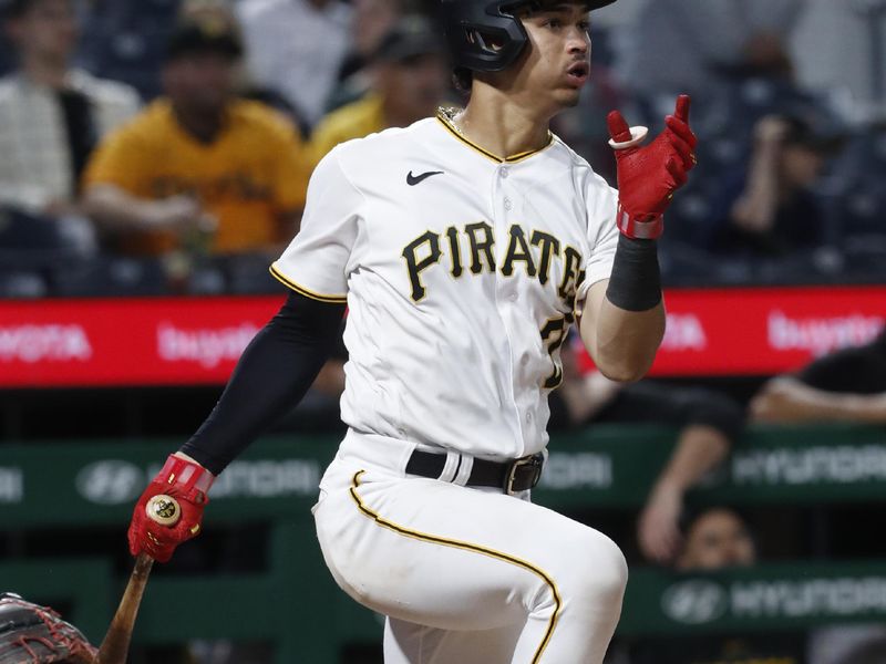 Sep 12, 2023; Pittsburgh, Pennsylvania, USA; Pittsburgh Pirates catcher Endy Rodriguez (25) hits a double against the Washington Nationals during the fifth inning at PNC Park. Mandatory Credit: Charles LeClaire-USA TODAY Sports