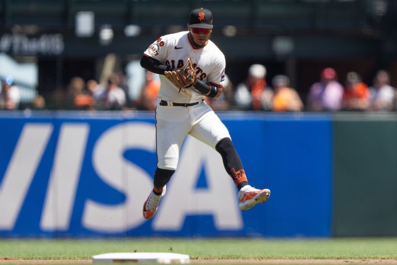 Aug 13, 2023; San Francisco, California, USA; San Francisco Giants second baseman Thairo Estrada (39) catches the ball during the fourth inning against the Texas Rangers at Oracle Park. Mandatory Credit: Stan Szeto-USA TODAY Sports