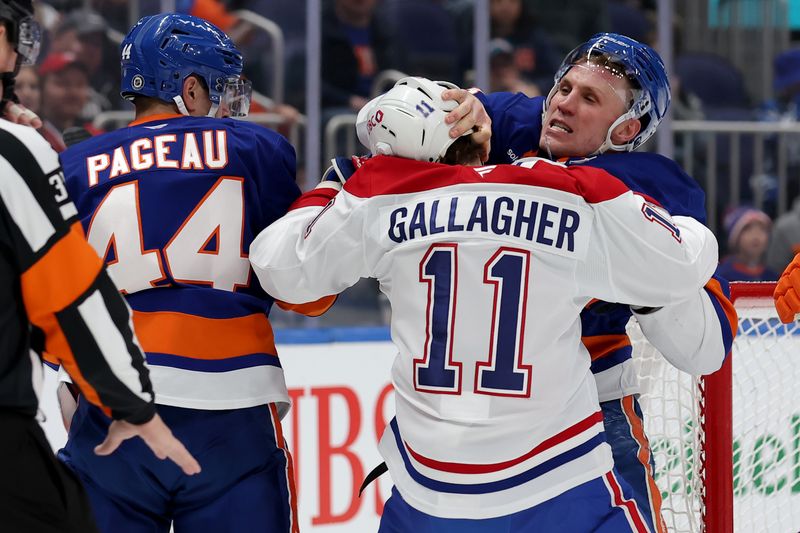 Mar 20, 2025; Elmont, New York, USA; Montreal Canadiens right wing Brendan Gallagher (11) fights with New York Islanders centers Casey Cizikas (53) and Jean-Gabriel Pageau (44) during the first period at UBS Arena. Mandatory Credit: Brad Penner-Imagn Images