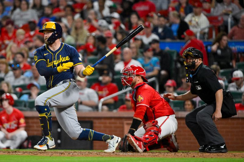 Apr 25, 2025; St. Louis, Missouri, USA;  Milwaukee Brewers first baseman Rhys Hoskins (12) hits a single against the St. Louis Cardinals during the seventh inning at Busch Stadium. Mandatory Credit: Jeff Curry-Imagn Images