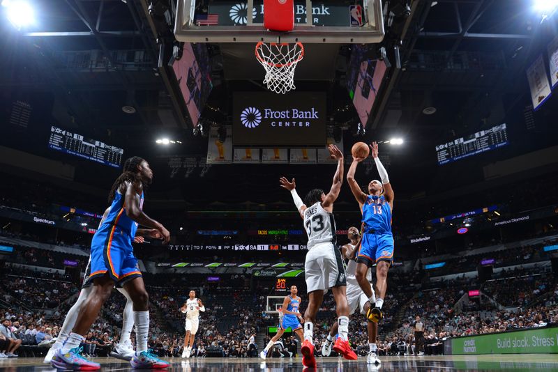 SAN ANTONIO, TX - OCTOBER 7: Ousmane Dieng #13 of the Oklahoma City Thunder drives to the basket during the game against the San Antonio Spurs during a NBA preseason game on October 7, 2024 at the Frost Bank Center in San Antonio, Texas. NOTE TO USER: User expressly acknowledges and agrees that, by downloading and or using this photograph, user is consenting to the terms and conditions of the Getty Images License Agreement. Mandatory Copyright Notice: Copyright 2024 NBAE (Photos by Michael Gonzales/NBAE via Getty Images)