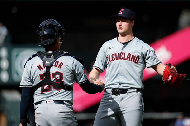 Apr 3, 2024; Seattle, Washington, USA; Cleveland Guardians relief pitcher Tim Herrin (29) shakes hands with catcher Bo Naylor (23) following the final out of an 8-0 victory against the Seattle Mariners at T-Mobile Park. Mandatory Credit: Joe Nicholson-USA TODAY Sports