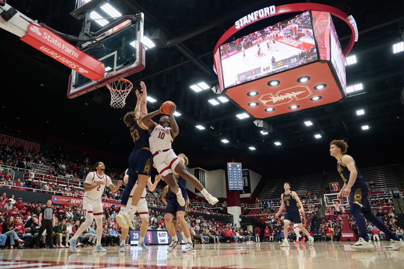 Dec 30, 2025; Stanford, California, USA; Stanford Cardinal forward Chisom Okpara (10) shoots the ball against Notre Dame Fighting Irish forward Carson Towt (33) during the second half at Maples Pavilion. Mandatory Credit: Robert Edwards-Imagn Images