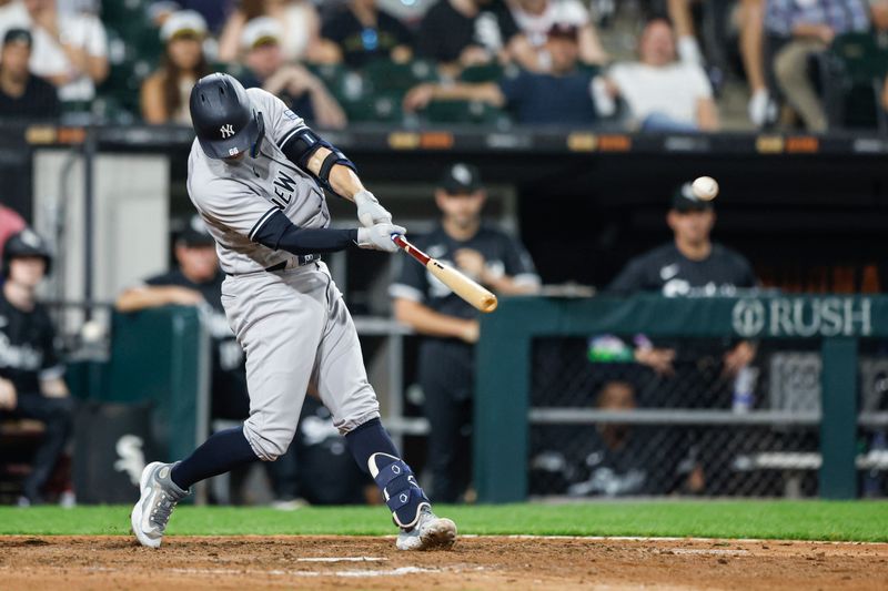 Aug 8, 2023; Chicago, Illinois, USA; New York Yankees catcher Kyle Higashioka (66) hits a two-run home run against the Chicago White Sox during the eighth inning at Guaranteed Rate Field. Mandatory Credit: Kamil Krzaczynski-USA TODAY Sports