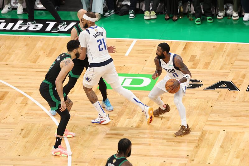 BOSTON, MA - JUNE 9: Kyrie Irving #11 of the Dallas Mavericks dribbles the ball during the game against the Boston Celtics during Game 2 of the 2024 NBA Finals on June 9, 2024 at the TD Garden in Boston, Massachusetts. NOTE TO USER: User expressly acknowledges and agrees that, by downloading and or using this photograph, User is consenting to the terms and conditions of the Getty Images License Agreement. Mandatory Copyright Notice: Copyright 2024 NBAE  (Photo by Joe Murphy/NBAE via Getty Images)