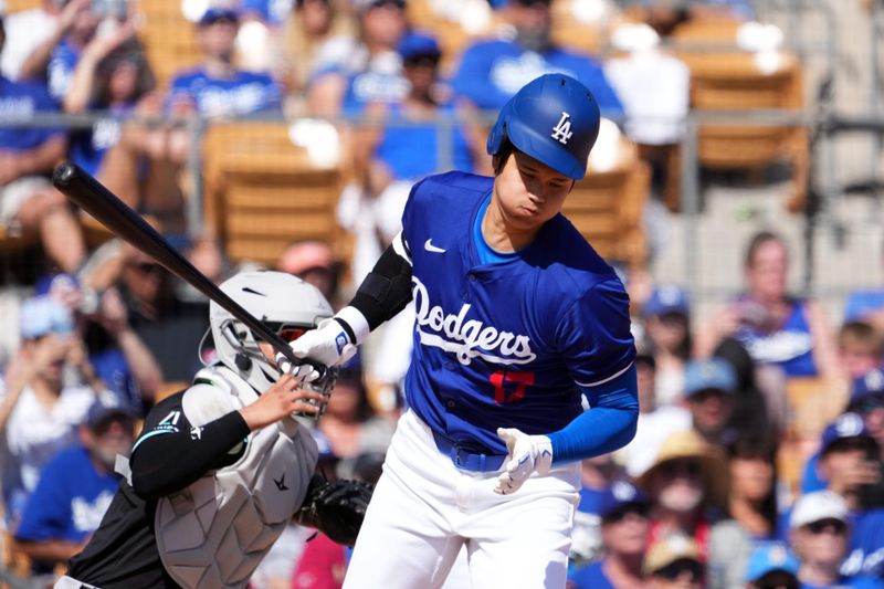 Mar 10, 2024; Phoenix, Arizona, USA; Los Angeles Dodgers designated hitter Shohei Ohtani (17) runs to first base en route to a ground out during the fourth inning at Camelback Ranch-Glendale. Mandatory Credit: Joe Camporeale-USA TODAY Sports