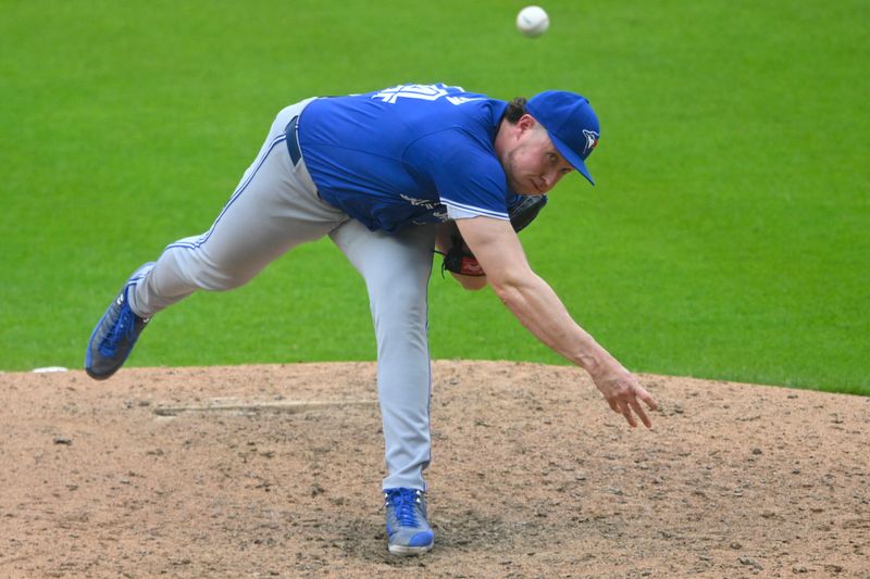 Jun 22, 2024; Cleveland, Ohio, USA; Toronto Blue Jays relief pitcher Nate Pearson (24) delivers against the Cleveland Guardians in the eighth inning at Progressive Field. Mandatory Credit: David Richard-USA TODAY Sports