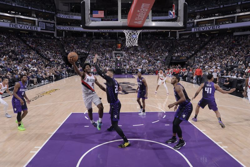 SACRAMENTO, CA - OCTOBER 28: Scoot Henderson #00 of the Portland Trail Blazers drives to the basket during the game against the Sacramento Kings on October 28, 2024 at Golden 1 Center in Sacramento, California. NOTE TO USER: User expressly acknowledges and agrees that, by downloading and or using this Photograph, user is consenting to the terms and conditions of the Getty Images License Agreement. Mandatory Copyright Notice: Copyright 2024 NBAE (Photo by Rocky Widner/NBAE via Getty Images)