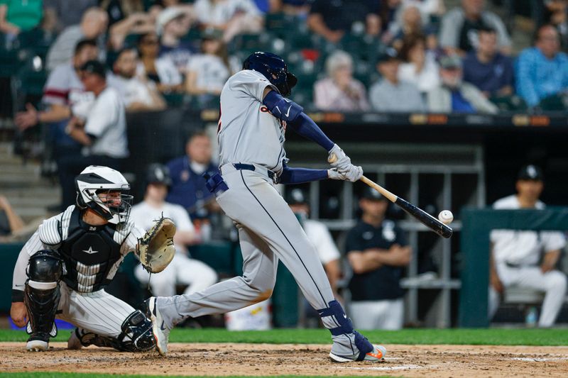 Jun 2, 2025; Chicago, Illinois, USA; Detroit Tigers center fielder Parker Meadows (22) hits a triple against the Chicago White Sox during the sixth inning at Rate Field. Mandatory Credit: Kamil Krzaczynski-Imagn Images