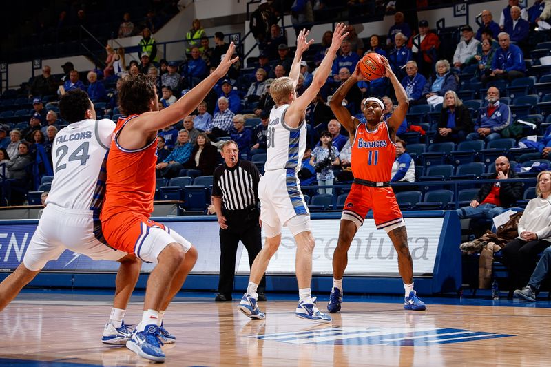Jan 31, 2023; Colorado Springs, Colorado, USA; Boise State Broncos guard Chibuzo Agbo (11) looks to pass the ball to forward Tyson Degenhart (2) against Air Force Falcons forward Rytis Petraitis (31) as guard Jeffrey Mills (24) defends in the first half at Clune Arena. Mandatory Credit: Isaiah J. Downing-USA TODAY Sports