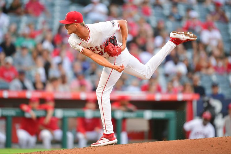 Jul 11, 2024; Anaheim, California, USA; Los Angeles Angels first baseman Nolan Schanuel (18) throws against the Seattle Mariners during the second inning at Angel Stadium. Mandatory Credit: Gary A. Vasquez-USA TODAY Sports