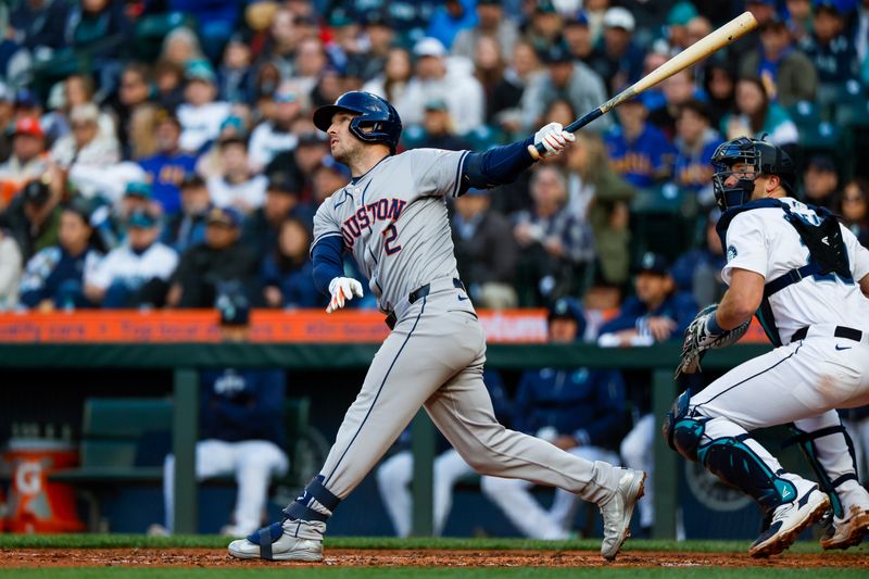 May 28, 2024; Seattle, Washington, USA; Houston Astros third baseman Alex Bregman (2) hits a two-run home run against the Seattle Mariners during the fourth inning at T-Mobile Park. Mandatory Credit: Joe Nicholson-USA TODAY Sports