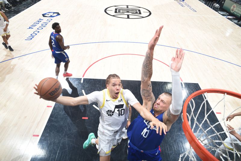 LOS ANGELES, CA - APRIL 12: Jason Preston #10 of the Utah Jazz drives to the basket during the game against the LA Clippers on April 12, 2024 at Crypto.Com Arena in Los Angeles, California. NOTE TO USER: User expressly acknowledges and agrees that, by downloading and/or using this Photograph, user is consenting to the terms and conditions of the Getty Images License Agreement. Mandatory Copyright Notice: Copyright 2024 NBAE (Photo by Adam Pantozzi/NBAE via Getty Images)