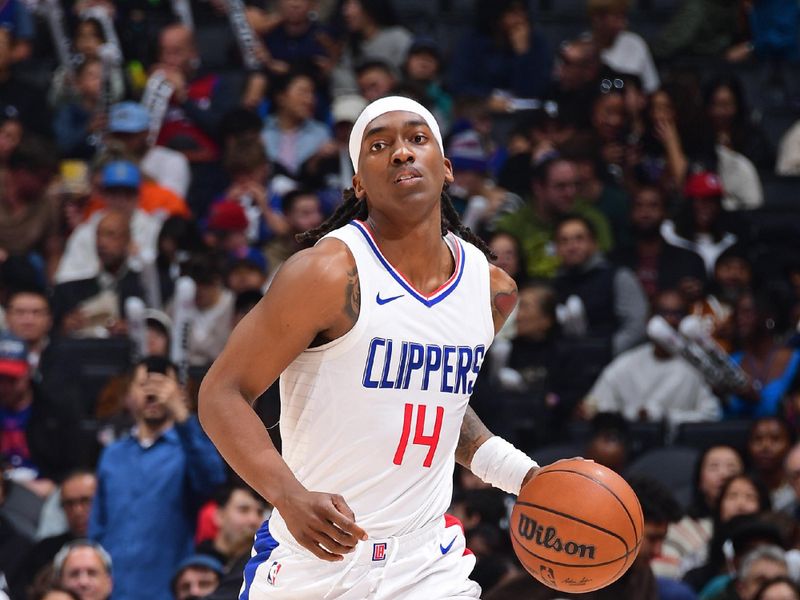 LOS ANGELES, CA - JANUARY 21: Terance Mann #14 of the LA Clippers brings the ball up court during the game against the Brooklyn Nets on January 21, 2024 at Crypto.Com Arena in Los Angeles, California. NOTE TO USER: User expressly acknowledges and agrees that, by downloading and/or using this Photograph, user is consenting to the terms and conditions of the Getty Images License Agreement. Mandatory Copyright Notice: Copyright 2024 NBAE (Photo by Adam Pantozzi/NBAE via Getty Images)