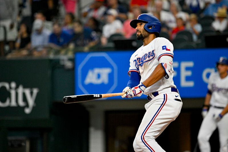 Aug 3, 2023; Arlington, Texas, USA; Texas Rangers second baseman Marcus Semien (2) hits a home run against the Chicago White Sox during the fourth inning at Globe Life Field. Mandatory Credit: Jerome Miron-USA TODAY Sports