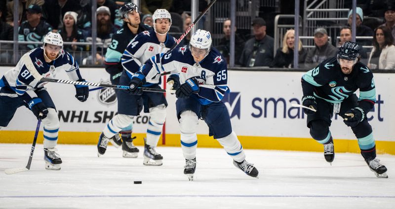 Oct 24, 2024; Seattle, Washington, USA;  Winnipeg Jets forward Mark Scheifele (55) skates with the puck during the second period against the Seattle Kraken at Climate Pledge Arena. Mandatory Credit: Stephen Brashear-Imagn Images