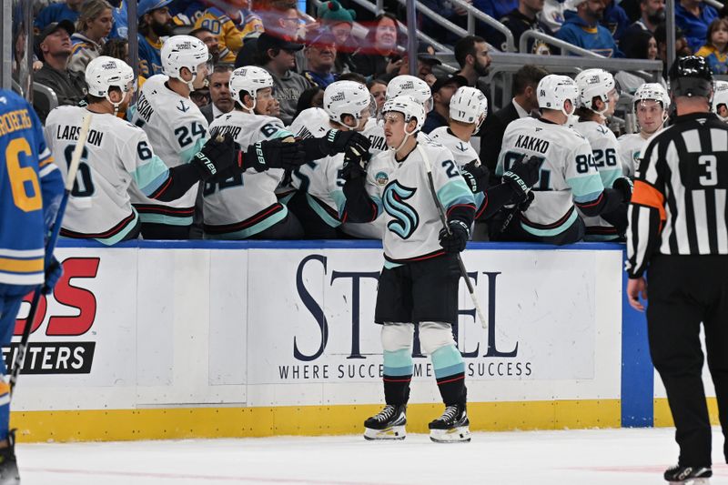 Nov 8, 2025; St. Louis, Missouri, USA; Seattle Kraken right wing Eeli Tolvanen (20) is congratulated after scoring a goal against the St. Louis Blues in the second period at Enterprise Center. Mandatory Credit: Joe Puetz-Imagn Images