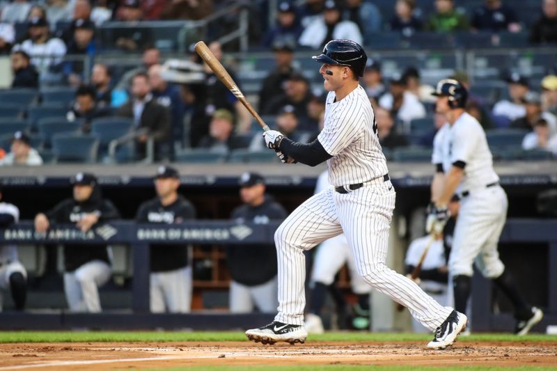 May 2, 2023; Bronx, New York, USA;  New York Yankees first baseman Anthony Rizzo (48) hits a single in the first inning against the Cleveland Guardians at Yankee Stadium. Mandatory Credit: Wendell Cruz-USA TODAY Sports