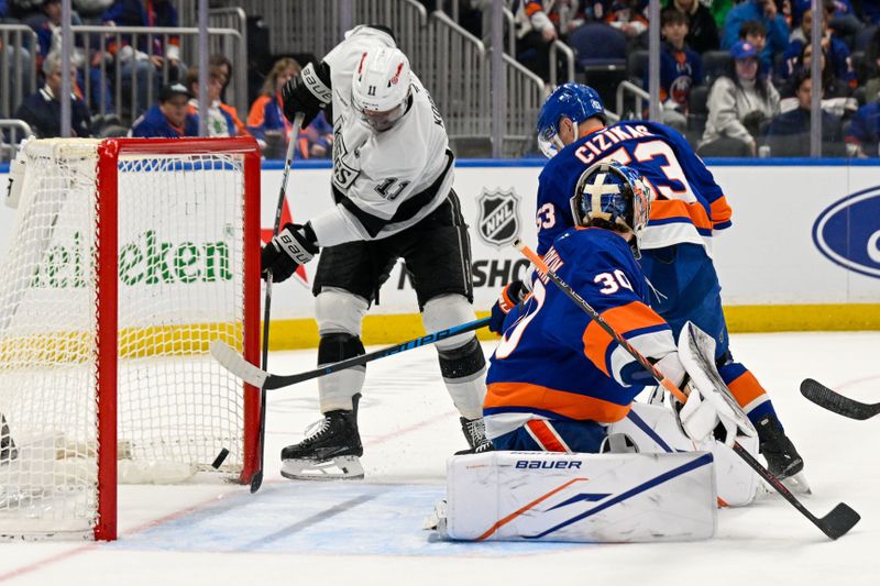 Mar 13, 2026; Elmont, New York, USA;  Los Angeles Kings center Anze Kopitar (11) scores a goal past New York Islanders goaltender Ilya Sorokin (30) during the first period at UBS Arena. Mandatory Credit: Dennis Schneidler-Imagn Images