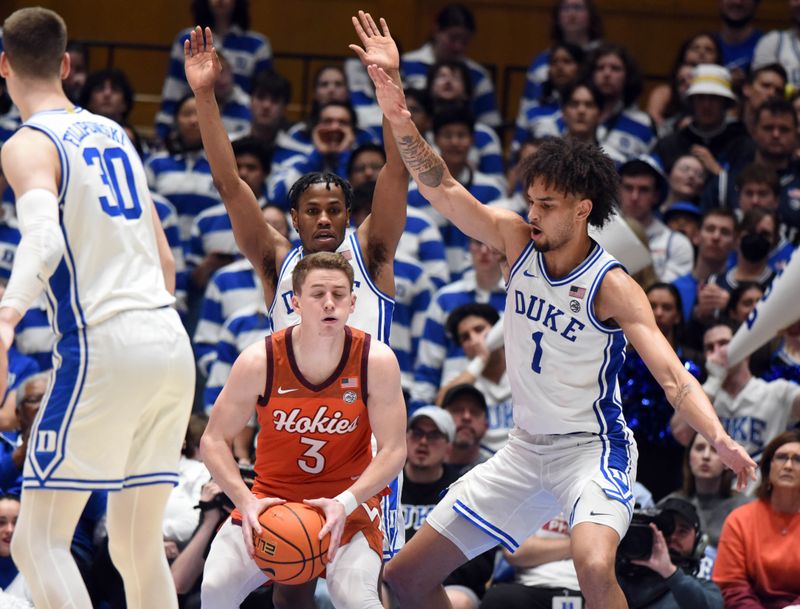 Feb 25, 2023; Durham, North Carolina, USA;  Virginia Tech Hokies guard Sean Pedulla (3) controls the ball in front of Duke Blue Devils guard Jeremy Roach (3) and center Dereck Lively (1) during the second half at Cameron Indoor Stadium. The Blue Devils won 81-65. Mandatory Credit: Rob Kinnan-USA TODAY Sports