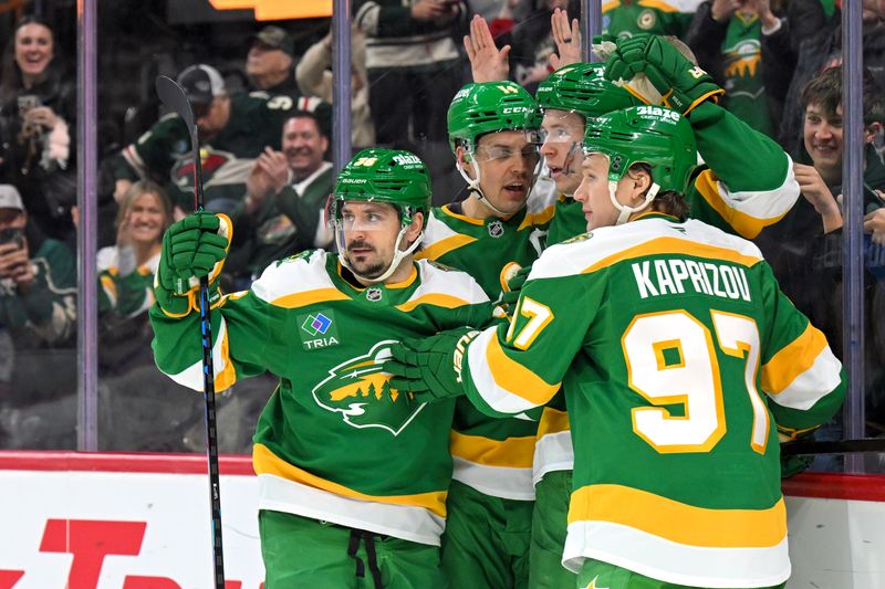 Mar 14, 2026; Saint Paul, Minnesota, USA;  Minnesota Wild forward Matt Boldy (12) celebrates his power play goal against the New York Rangers with forward Mats Zuccarello (36) and forward Joel Eriksson Ek (14) and forward Kirill Kaprizov (97) during the second period at Grand Casino Arena. Mandatory Credit: Nick Wosika-Imagn Images