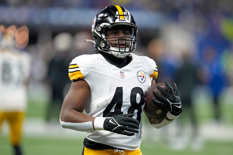 Pittsburgh Steelers running back Godwin Igwebuike (48) warms up before an NFL football game against the Indianapolis Colts in Indianapolis Saturday, Dec. 16, 2023. (AP Photo/Michael Conroy)