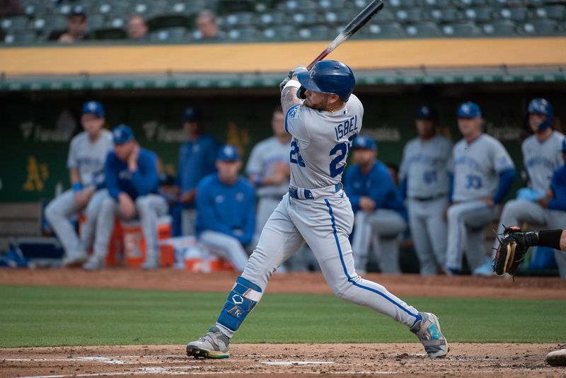 Aug 22, 2023; Oakland, California, USA; Kansas City Royals center fielder Kyle Isbel (28) hits an RBI single during the second inning against the Oakland Athletics at Oakland-Alameda County Coliseum. Mandatory Credit: Ed Szczepanski-USA TODAY Sports