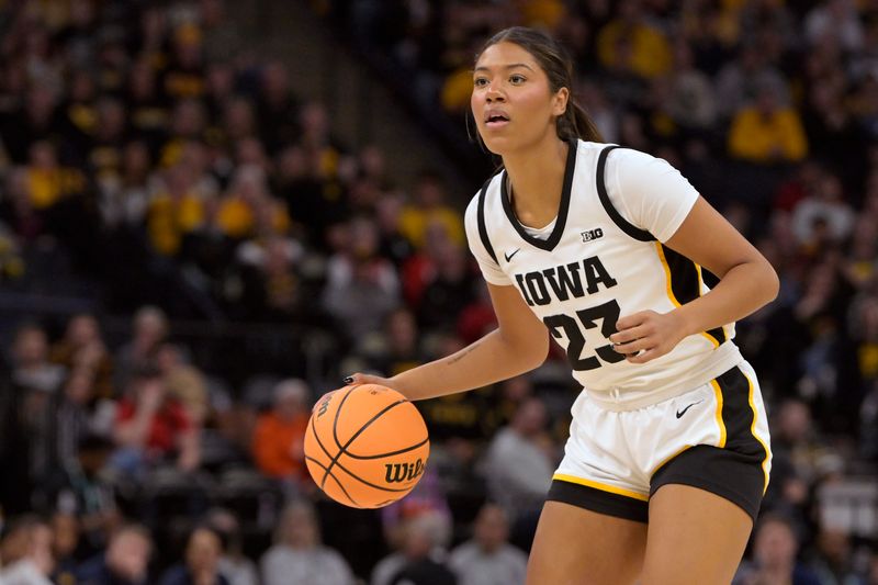 Mar 9, 2024; Minneapolis, MN, USA;  Iowa Hawkeyes forward Jada Gyamfi (23) controls the ball against the Michigan Wolverines during the second half of a Big Ten Women's Basketball tournament semifinal at Target Center. Mandatory Credit: Nick Wosika-USA TODAY Sports