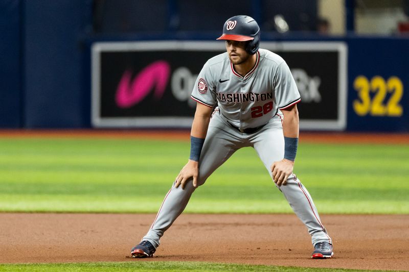 Jun 29, 2024; St. Petersburg, Florida, USA; Washington Nationals outfielder Lane Thomas (28) leads off first base against the Tampa Bay Rays during the first inning at Tropicana Field. Mandatory Credit: Matt Pendleton-USA TODAY Sports