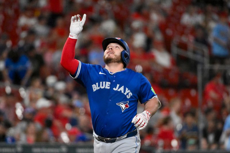 Jun 9, 2025; St. Louis, Missouri, USA;  Toronto Blue Jays catcher Alejandro Kirk (30) reacts after hitting a solo home run against the St. Louis Cardinals during the eighth inning at Busch Stadium. Mandatory Credit: Jeff Curry-Imagn Images