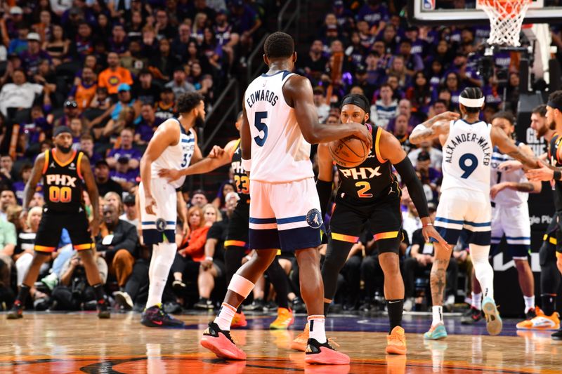 PHOENIX, AZ - APRIL 4: Anthony Edwards #5 of the Minnesota Timberwolves dribbles the ball during the game against the Phoenix Suns during Round 1 Game 4 of the 2024 NBA Playoffs on April 4, 2023 at Footprint Center in Phoenix, Arizona. NOTE TO USER: User expressly acknowledges and agrees that, by downloading and or using this photograph, user is consenting to the terms and conditions of the Getty Images License Agreement. Mandatory Copyright Notice: Copyright 2024 NBAE (Photo by Barry Gossage/NBAE via Getty Images)