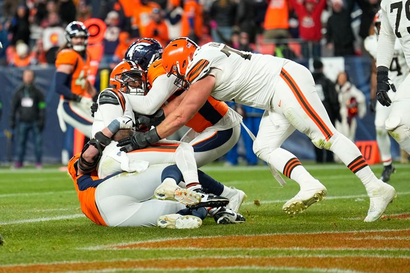 Cleveland Browns quarterback PJ Walker is sacked in the end zone during the second half of an NFL football game against the Denver Broncos on Sunday, Nov. 26, 2023, in Denver. (AP Photo/Jack Dempsey)