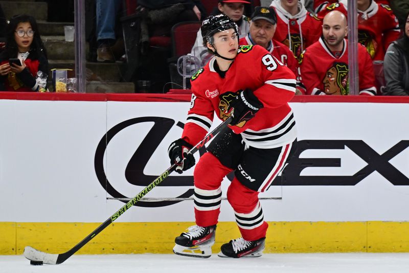 Nov 21, 2024; Chicago, Illinois, USA; Chicago Blackhawks center Connor Bedard (98) plays the puck against the Florida Panthers during the second period at the United Center. Mandatory Credit: Daniel Bartel-Imagn Images