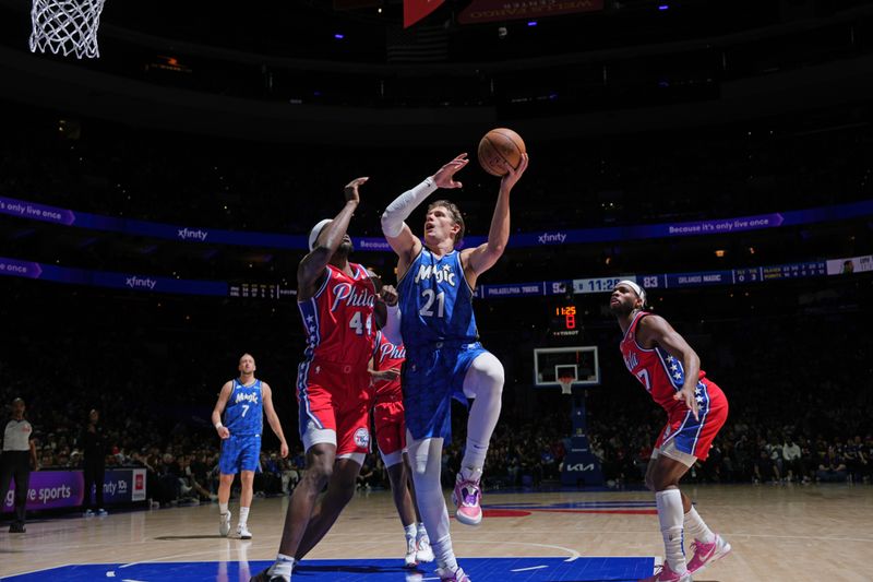 PHILADELPHIA, PA - APRIL 12: Moritz Wagner #21 of the Orlando Magic drives to the basket during the game against the Philadelphia 76ers on April 12, 2024 at the Wells Fargo Center in Philadelphia, Pennsylvania NOTE TO USER: User expressly acknowledges and agrees that, by downloading and/or using this Photograph, user is consenting to the terms and conditions of the Getty Images License Agreement. Mandatory Copyright Notice: Copyright 2024 NBAE (Photo by Jesse D. Garrabrant/NBAE via Getty Images)