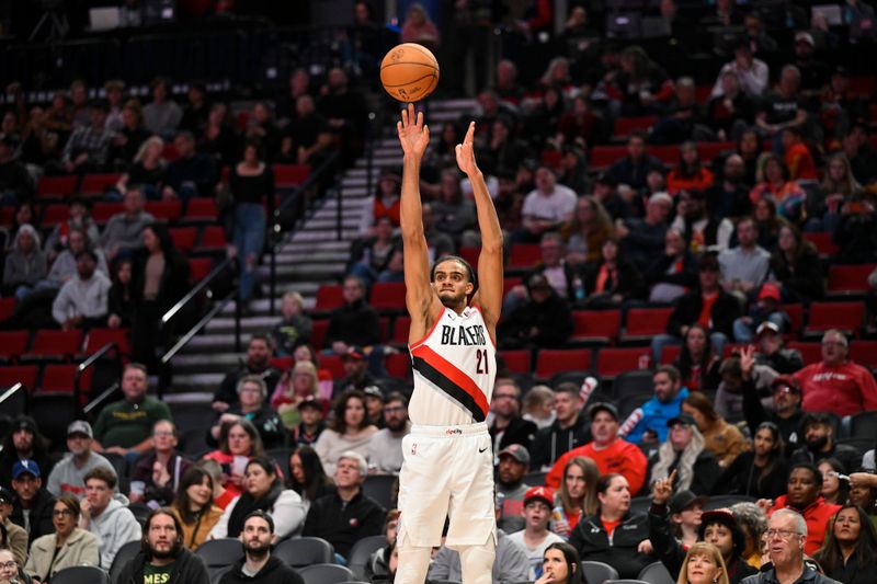 PORTLAND, OREGON - OCTOBER 18: Rayan Rupert #21 of the Portland Trail Blazers attempts a three point basket during the fourth quarter of the preseason game against the Utah Jazz at Moda Center on October 18, 2024 in Portland, Oregon. NOTE TO USER: User expressly acknowledges and agrees that, by downloading and or using this photograph, User is consenting to the terms and conditions of the Getty Images License Agreement. (Photo by Alika Jenner/Getty Images)