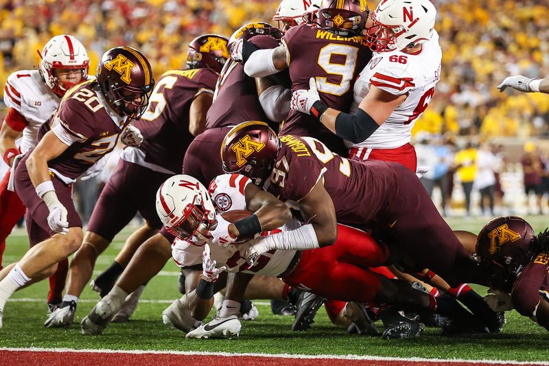 Aug 31, 2023; Minneapolis, Minnesota, USA; Nebraska Cornhuskers running back Gabe Ervin Jr. (22) runs the ball against the Minnesota Golden Gophers during the second quarter at Huntington Bank Stadium. Mandatory Credit: Matt Krohn-USA TODAY Sports