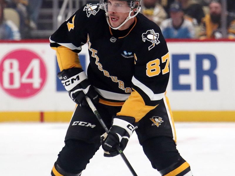 Oct 29, 2024; Pittsburgh, Pennsylvania, USA;  Pittsburgh Penguins center Sidney Crosby (87) skates up ice with the puck against the Minnesota Wild during the first period at PPG Paints Arena. Mandatory Credit: Charles LeClaire-Imagn Images