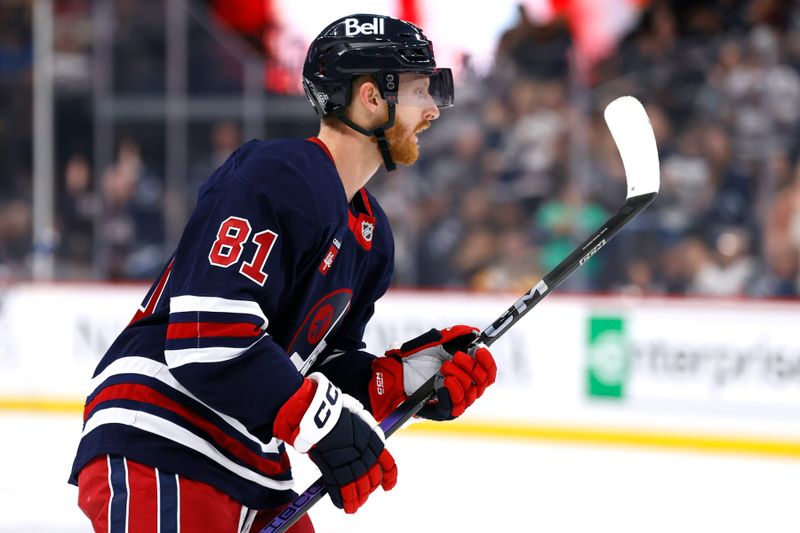 Oct 20, 2024; Winnipeg, Manitoba, CAN; Winnipeg Jets left wing Kyle Connor (81) celebrates his second period goal against the Pittsburgh Penguins at Canada Life Centre. Mandatory Credit: James Carey Lauder-Imagn Images