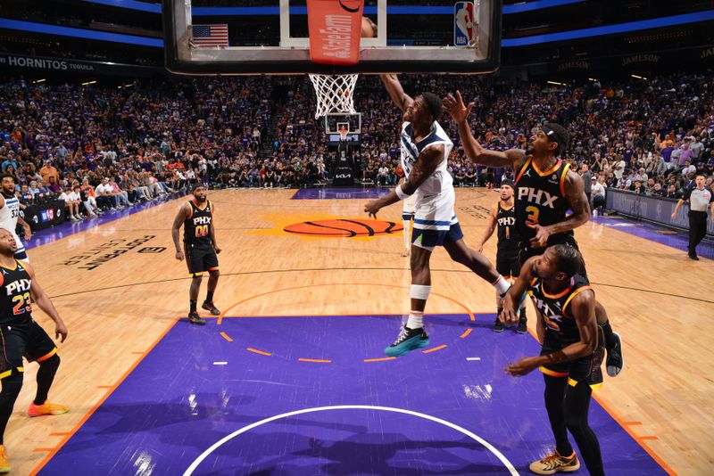 PHOENIX, AZ - APRIL 4: Anthony Edwards #5 of the Minnesota Timberwolves dunks the ball during the game against the Phoenix Suns during Round 1 Game 4 of the 2024 NBA Playoffs on April 4, 2023 at Footprint Center in Phoenix, Arizona. NOTE TO USER: User expressly acknowledges and agrees that, by downloading and or using this photograph, user is consenting to the terms and conditions of the Getty Images License Agreement. Mandatory Copyright Notice: Copyright 2024 NBAE (Photo by Barry Gossage/NBAE via Getty Images)