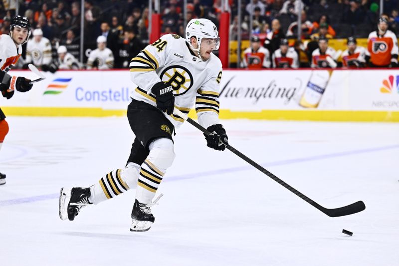 Jan 27, 2024; Philadelphia, Pennsylvania, USA; Boston Bruins center Jakub Lauko (94) controls the puck against the Philadelphia Flyers in the third period at Wells Fargo Center. Mandatory Credit: Kyle Ross-USA TODAY Sports