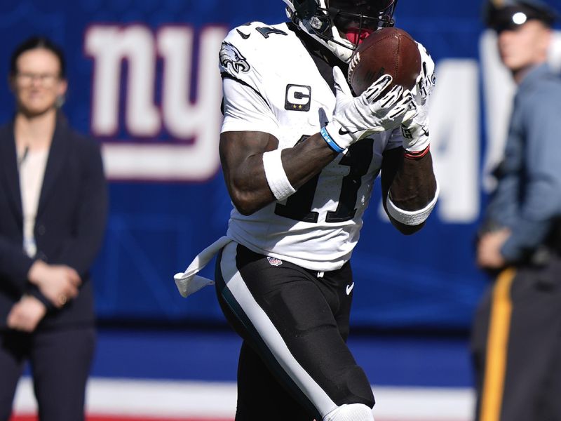 Philadelphia Eagles wide receiver A.J. Brown (11) makes a touchdown catch against the New York Giants during the second quarter of an NFL football game, Sunday, Oct. 20, 2024, in East Rutherford, N.J. (AP Photo/Frank Franklin II)