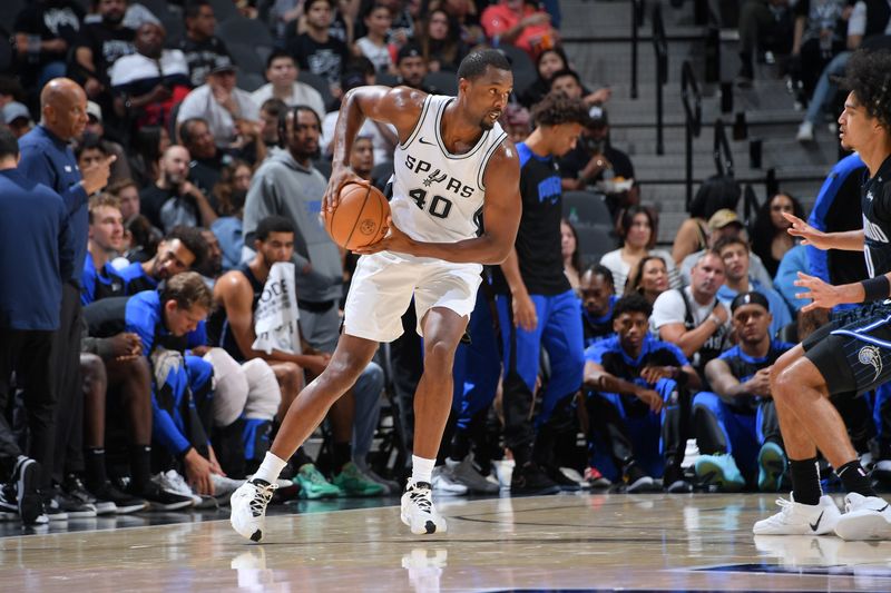 SAN ANTONIO, TX - OCTOBER 9: Harrison Barnes #40 of the San Antonio Spurs handles the ball during the game against the Orlando Magic during a NBA preseason game on October 9, 2024 at the Frost Bank Center in San Antonio, Texas. NOTE TO USER: User expressly acknowledges and agrees that, by downloading and or using this photograph, user is consenting to the terms and conditions of the Getty Images License Agreement. Mandatory Copyright Notice: Copyright 2024 NBAE (Photos by Michael Gonzales/NBAE via Getty Images)
