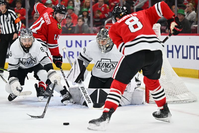 Mar 15, 2024; Chicago, Illinois, USA; Los Angeles Kings goaltender Cam Talbot (39) tracks the puck as defenseman Drew Doughty (8) helps defend in the second period against the Chicago Blackhawks at United Center. Mandatory Credit: Jamie Sabau-USA TODAY Sports