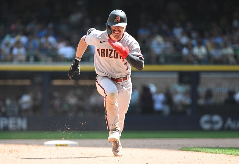 Jun 21, 2023; Milwaukee, Wisconsin, USA; Arizona Diamondbacks left fielder Corbin Carroll (7) runs to third base against the Milwaukee Brewers at American Family Field. Mandatory Credit: Michael McLoone-USA TODAY Sports